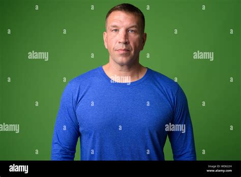 Portrait Of Macho Mature Man Looking At Camera Stock Photo Alamy