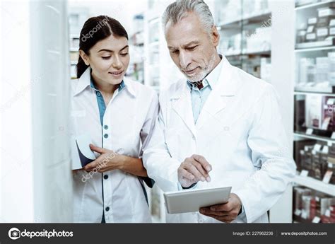 Attentive Brunette Female Person Listening To Her Colleague Stock Photo Yacobchuk