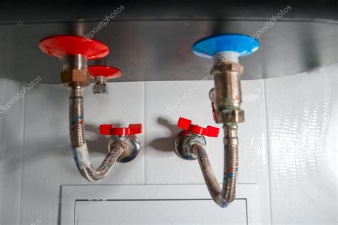 Two Flexible Water Pipes For Cold And Hot Water Connected In To The Home Boiler In Bathroom
