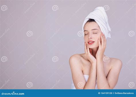 Sensual Brunette In A White Towel Touches Her Face Stock Photo Image Of Cosmetic Girl