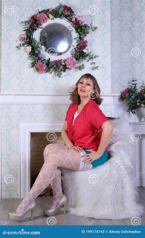 Blonde Model In White Stockings And Green Miniskirt Posing In Studio Stock Image Image Of Girl