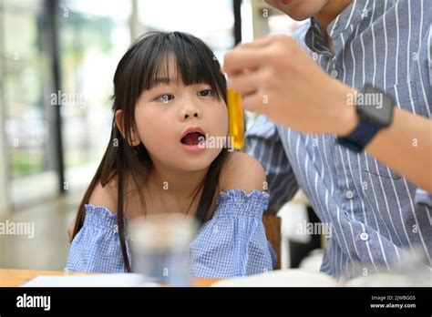 Cute Young Asian Girl Excited And Amazed While Her Science Teacher