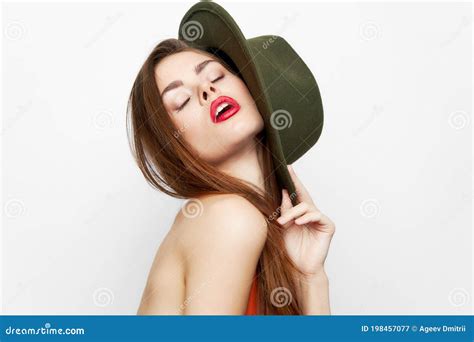 Woman In A Green Hat Naked Shoulder Closed Eyes Charm Stock Image
