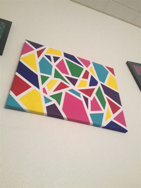 Canvas wall art. Used tape to make shapes, painted with different colors, dry, peal tape off ...