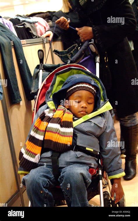 Baby Wrapped Up For Winter In A Pushchair Stock Photo Alamy