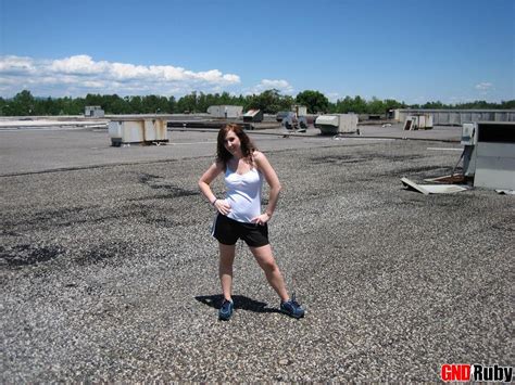 Horny Redhead Ruby Flashes Her Tits On The Roof As She Rubs Her Wet Pussy Porn Pictures XXX