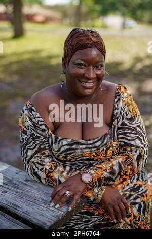 BBW Big Black Beautiful Model Sitting On A Park Bench Outdoors Stock Photo Alamy