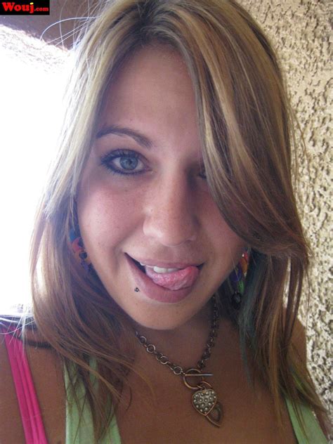 Good Looking Babe Teasing With Her Pink Bra While Posing Photos