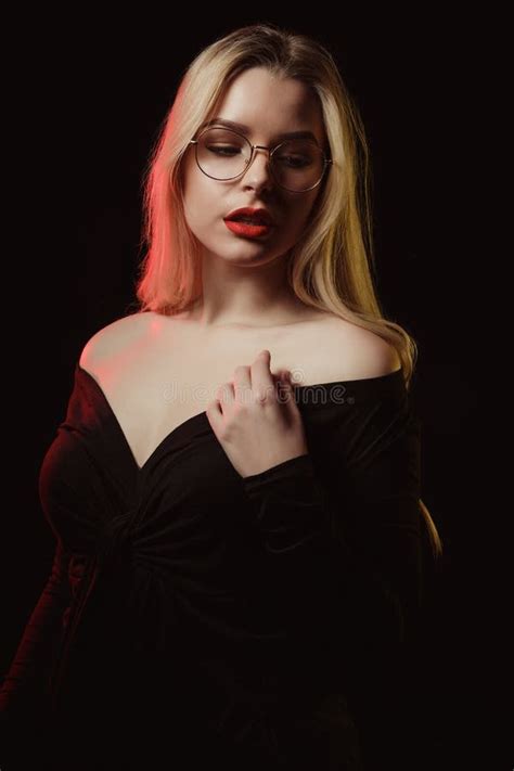 Pleased Blonde Girl In Glasses Wearing Blouse With Naked Shoulders Stock Photo Image Of