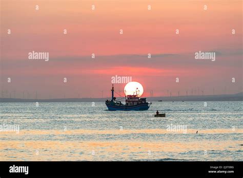 Sunset Landscape When Fishing Boats Out To Sea To Harvest Fish End The