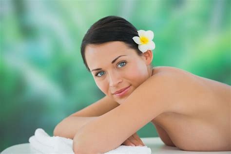 Premium Photo Beautiful Brunette Relaxing On Massage Table Smiling At Camera