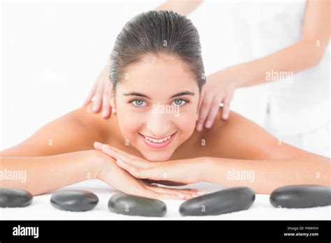 Brunette Enjoying Hot Stone Massage Hi Res Stock Photography And Images