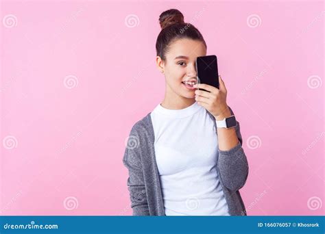 Portrait Of Joyful Brunette Teen Girl Smiling And Covering Half Face