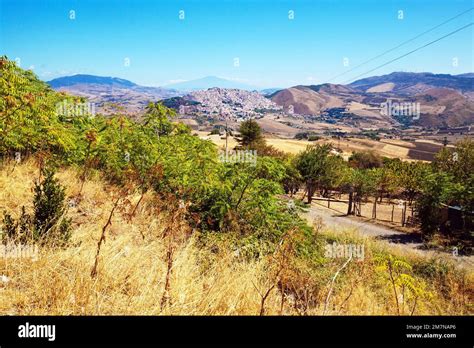 View Of The Hill Village Of Gangi With Mount Etna In The Haze On The