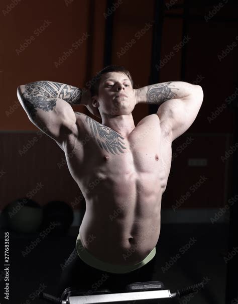 Muscular Bodybuilder Handsome Men Doing Exercises In Gym Naked Torso