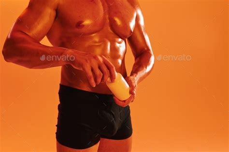 Man Bodybuilder Boxer With Naked Torso With Abs Holding Can Muscle Growth Pills Steroids