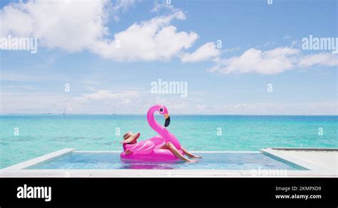 Travel Vacation Woman Relaxing In Pool By Beach Sunbathing In Bikini In Stock Video Footage Alamy
