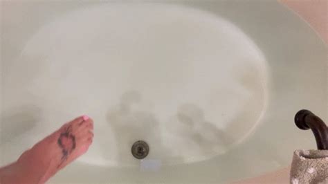 Carissa Wearing The Sparkly Sheer Bodysuit In The Bathtub And Wielding Her Glass Dildo