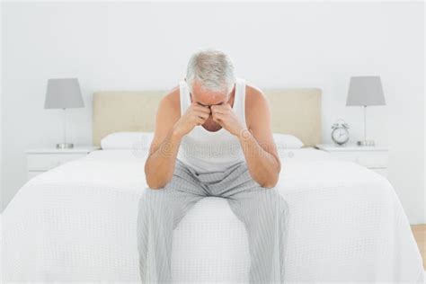 Thoughtful Mature Man Sitting In Bed Stock Image Image Of White View