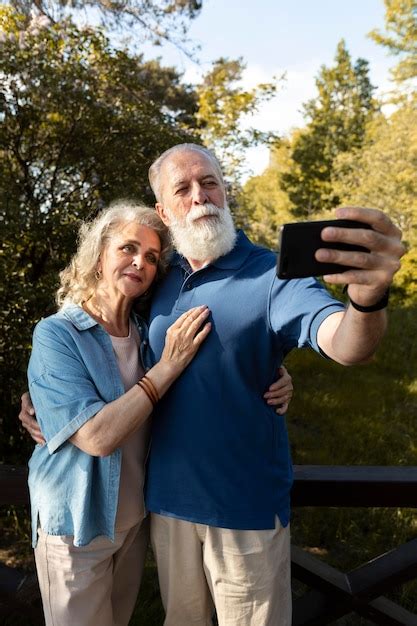 Free Photo Medium Shot Senior Couple Taking Selfie