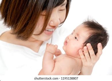 Naked Newborn Baby Supported By Mother Stock Photo 1195138807