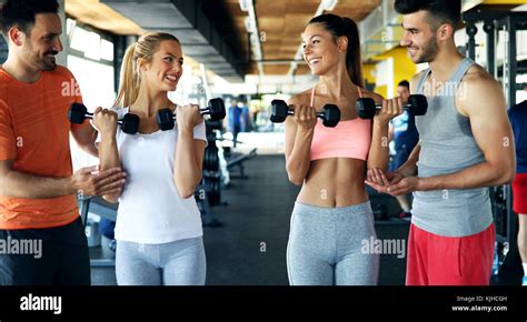 Group Of Friends Exercising Together In Gym Stock Photo Alamy