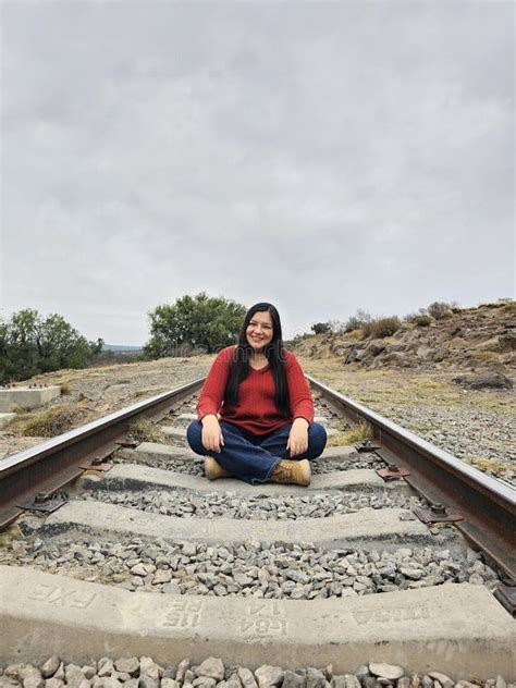 Year Old Latina Woman Sitting On Train Tracks Discovers And Explores