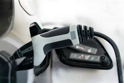 Plugged cable charging an electric car at home. 19773630 Stock Photo at ...