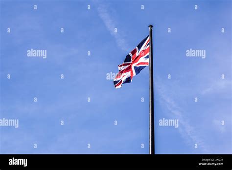 The British flag waving in the wind Stock Photo - Alamy