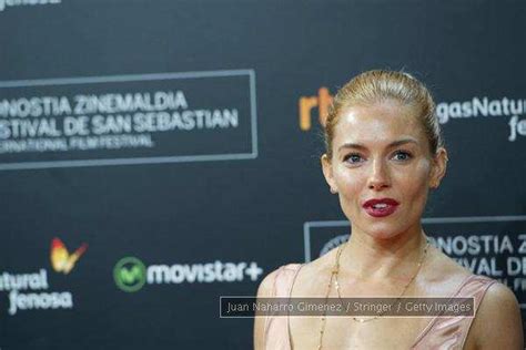 Sienna Miller Denies Flirting With Brad Pitt