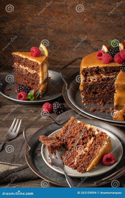 Delicious Semi Naked Chocolate Cake With Caramel Topping And Decorated With Blackberries And
