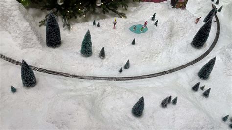 Electric train in the snow, christmas toy 11313758 Stock Video at Vecteezy