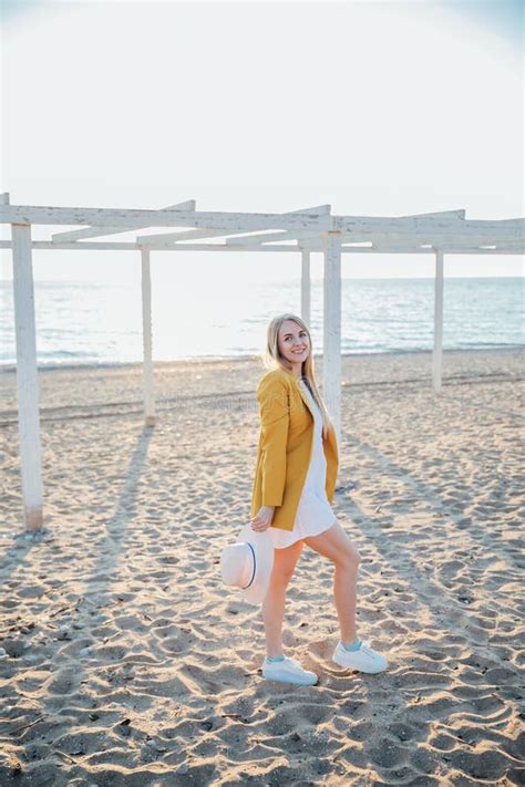 Beautiful Blonde Woman Walking On The Beach Of The Sea Stock Image Image Of Dawn Beach