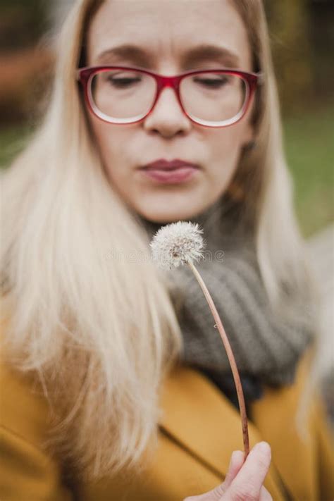 Slender Blonde With Long Hair Blowing On Dandelion Stock Photo Image Of Date Long