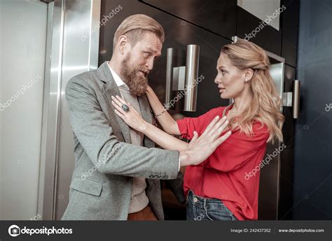 Negative Delighted Blonde Male Person Staring At His Colleague Stock Photo Yacobchuk
