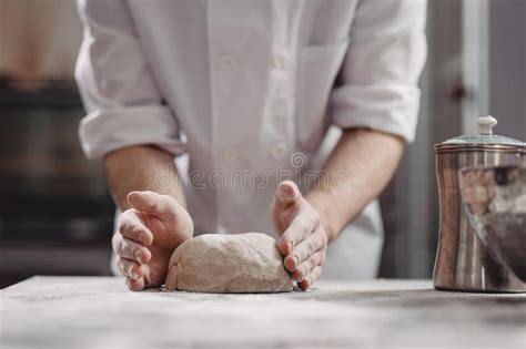 Baker Kneads Dough On The Table In The Bakery Stock Image Image Of Kneading Baker 146994509