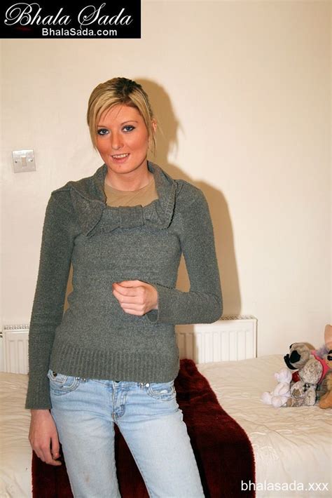 Sweet Blonde Chick Posing In A Shirt And Jeans Photos