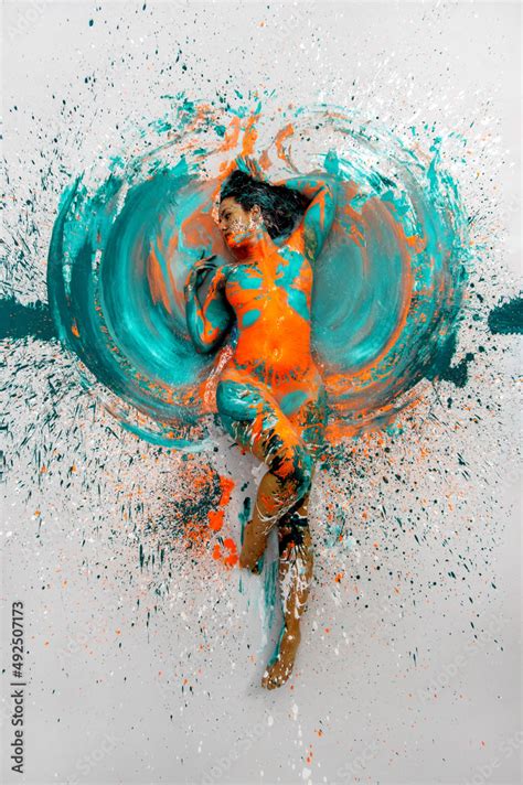 Top View To Expressive Sexy Naked Woman Lying Elegant On The Floor In Turquoise Blue Orange