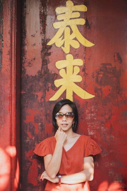 Premium Photo Asian Woman Wearing Red Shirt Standing Pose Red Wooden