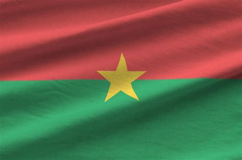 Premium Photo | Burkina faso flag with big folds waving close up under ...