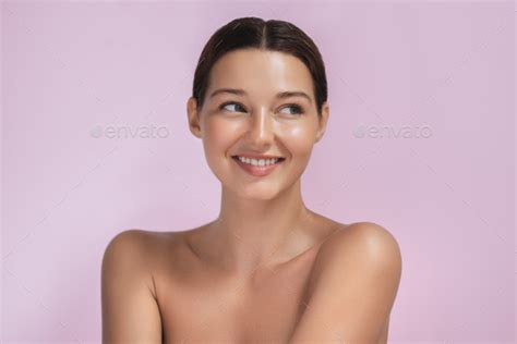 Excited Smiling Brunette Beauty Spa Woman With Naked Shoulders Undress On Pink Background Stock