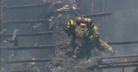 Watch Firefighter Falls Through Roof Of Burning Building Cbs News