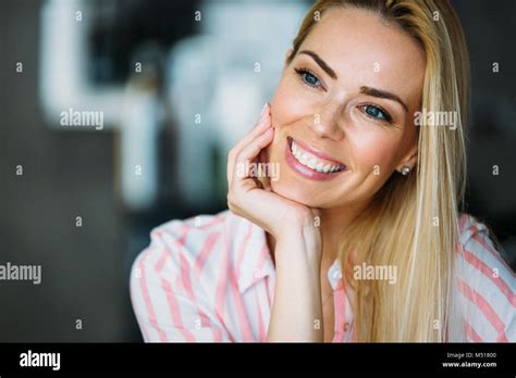 Portrait Of A Beautiful Blonde Woman Smiling Stock Photo Alamy