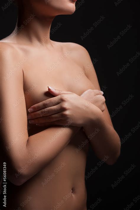 Naked Woman Cropped Image Of Naked Woman Covering Breast With H Stock Photo Adobe Stock