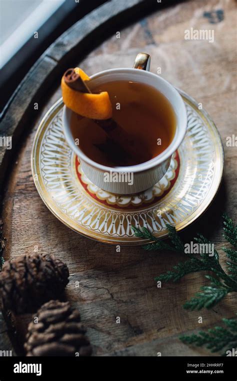 Hot Toddy With Orange In Teacup On Whiskey Barrel Stock Photo Alamy