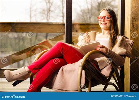 Woman Sitting On Chair Reading Book At Home Stock Image Image Of