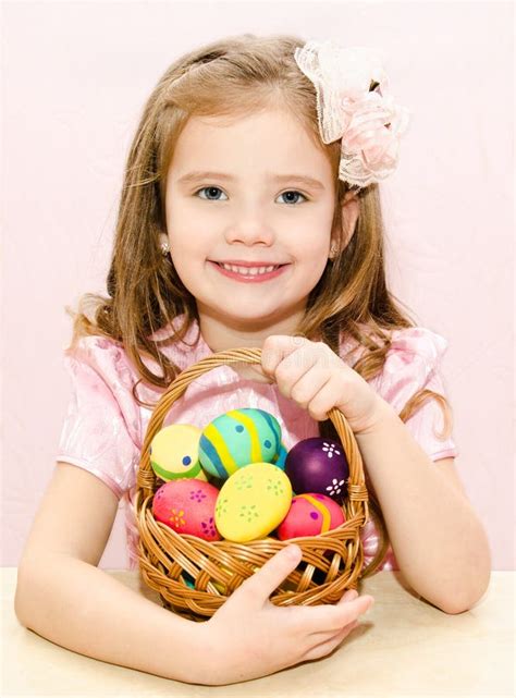 Smiling Cute Teen Girl With Rabbit Ears Holding Easter Chocolate Stock