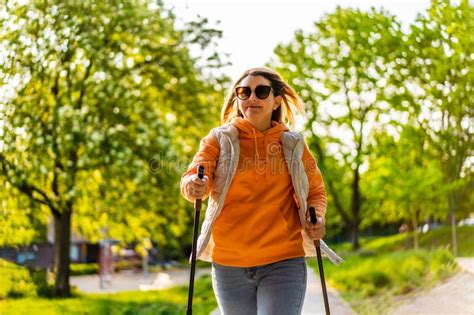 Nordic Walking Mature Woman Exercising In City Park Stock Photo Image Of Person Leisure