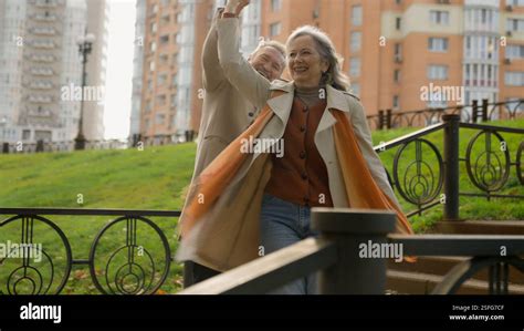 Caucasian Mature Middle Aged Woman Man Married Couple Dance Together Slow Movement Retired Wife