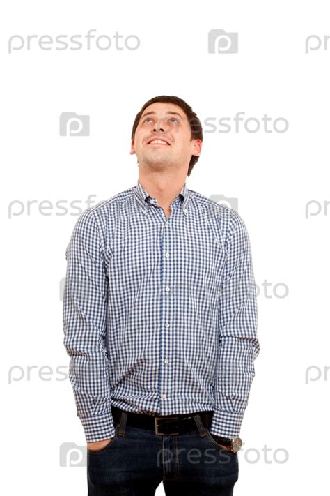 Фотография на тему Счастливый молодой человек смотрит вверх | PressFoto